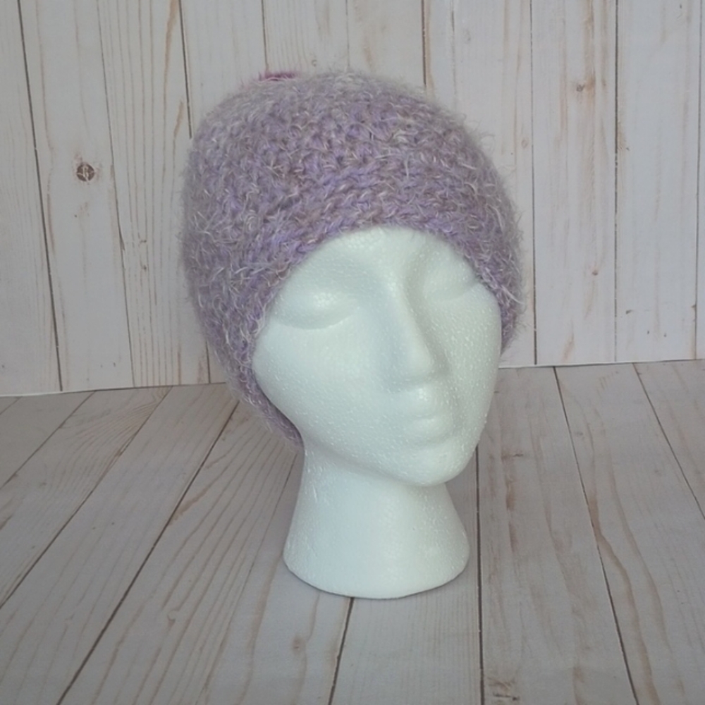 Hand crocheted beanie with faux fur pom